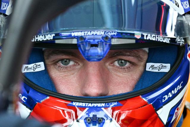 Red Bull Racing's Dutch driver Max Verstappen sits in his car in the pits during a practice session ahead of the Formula One Singapore Grand Prix at the Marina Bay Street Circuit in Singapore on October 9, 2026. (Photo by ANTHONY WALLACE / AFP)