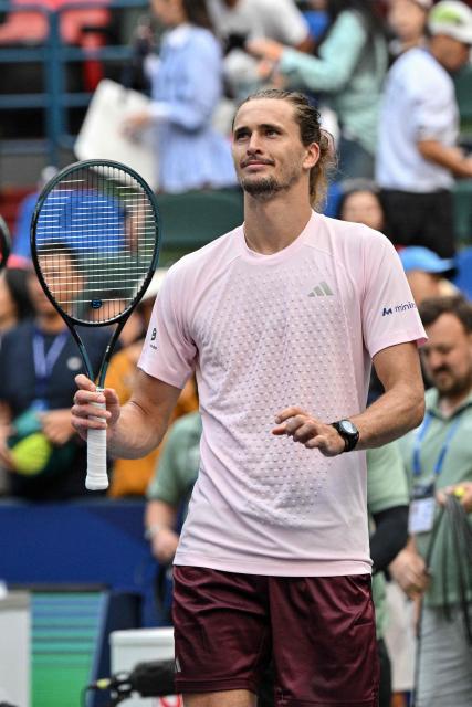 Germany's Alexander Zverev celebrates after winning against China's Wu Yibing during their men's singles match at the Shanghai Masters tennis tournament in Shanghai on October 9, 2026. (Photo by Hector RETAMAL / AFP)