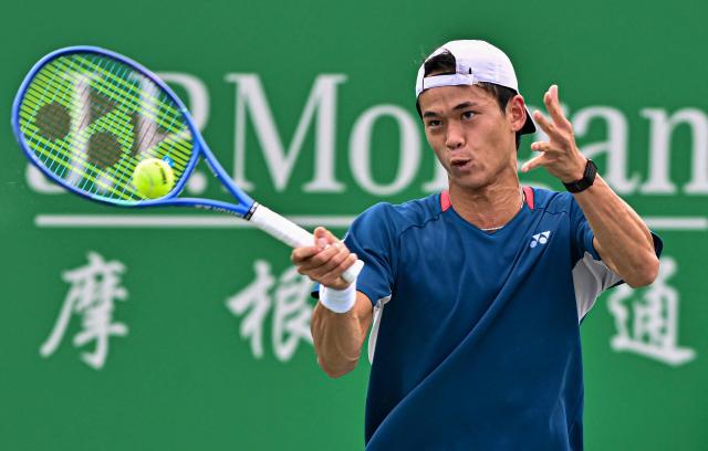Japan's Rei Sakamoto hits a return to Russia's Andrey Rublev during their men's singles match at the Shanghai Master tennis tournament in Shanghai on October 9, 2026. (Photo by CN-STR / AFP) / China OUT