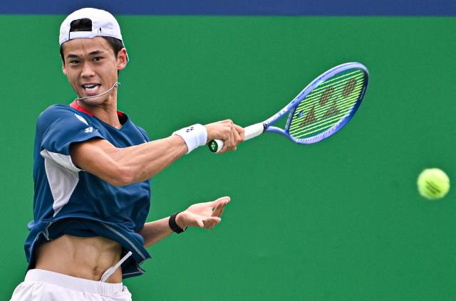Japan's Rei Sakamoto hits a return to Russia's Andrey Rublev during their men's singles match at the Shanghai Master tennis tournament in Shanghai on October 9, 2026. (Photo by CN-STR / AFP) / China OUT