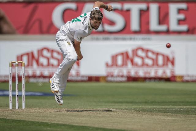 TOPSHOT - South Africa's Wiaan Mulder delivers a ball on day one of the first Test match between South Africa and Australia at the Kingsmead stadium in Durban on October 9, 2026. (Photo by Marco Longari / AFP)