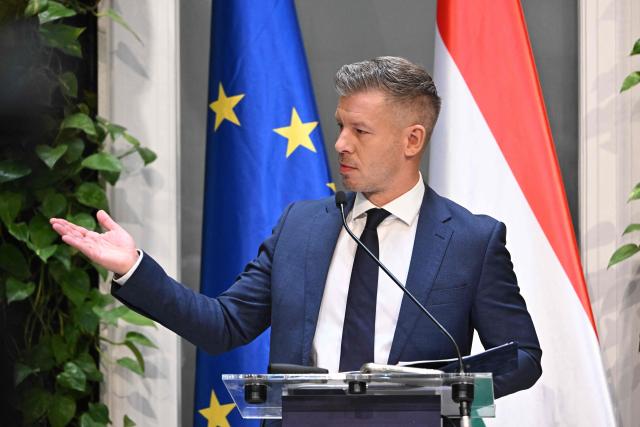 Hungarian Prime Minister Peter Magyar and the Minister for Transport and Investments address a press conference at the Prime Minister's Office in Budapest on October 9, 2026, following a cabinet meeting focused on the 2027 budget, child protection measures, and transport and investment policies. (Photo by Attila KISBENEDEK / AFP)