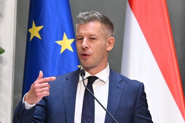 Hungarian Prime Minister Peter Magyar and the Minister for Transport and Investments address a press conference at the Prime Minister's Office in Budapest on October 9, 2026, following a cabinet meeting focused on the 2027 budget, child protection measures, and transport and investment policies. (Photo by Attila KISBENEDEK / AFP)