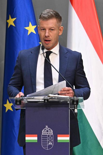 Hungarian Prime Minister Peter Magyar and the Minister for Transport and Investments address a press conference at the Prime Minister's Office in Budapest on October 9, 2026, following a cabinet meeting focused on the 2027 budget, child protection measures, and transport and investment policies. (Photo by Attila KISBENEDEK / AFP)