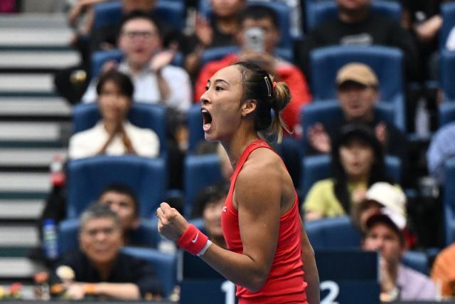 China’s Zheng Qinwen reacts during her women’s singles quarter-final match against Ukraine’s Elina Svitolina at the China Open tennis tournament in Beijing on October 9, 2026. (Photo by Pedro PARDO / AFP)