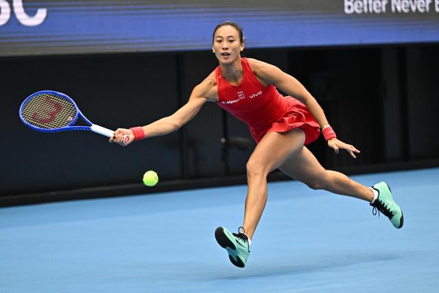 China’s Zheng Qinwen hits a return to Ukraine’s Elina Svitolina during their women’s singles quarter-final at the China Open tennis tournament in Beijing on October 9, 2026. (Photo by Pedro Pardo / AFP)
