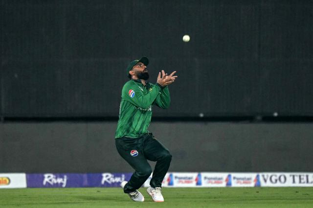 Pakistan's Fakhar Zaman takes a catch to dismiss Sri Lanka's Kamindu Mendis during the first T20 international cricket match between Pakistan and Sri Lanka at the Rawalpindi Cricket Stadium in Rawalpindi on October 9, 2026. (Photo by FAROOQ NAEEM / AFP)