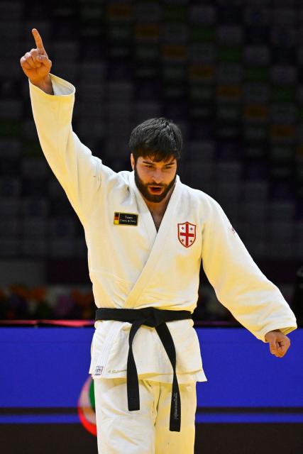 Georgia's Ilia Sulamanidze reacts after winning the men's under 100 kg gold medal bout at the World Judo Championships in Baku on October 9, 2026. (Photo by Alexander NEMENOV / AFP)