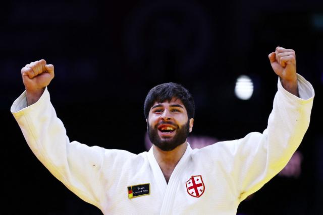 Georgia's Ilia Sulamanidze reacts after winning the men's under 100 kg gold medal bout at the World Judo Championships in Baku on October 9, 2026. (Photo by Anne-Christine POUJOULAT / AFP)