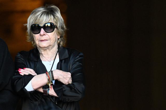(FILES) French media entrepreneur Michele "Mimi" Marchand  attends the funeral ceremony of French actress Nathalie Baye at the Saint-Sulpice church in Paris on April 24, 2026. Mimi Marchand will appear before the Paris Court of Appeal on October 12, 2026, in a case involving the alleged extortion of French television host Karine Le Marchand. (Photo by JULIEN DE ROSA / AFP)