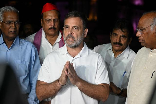 India's Congress party leader Rahul Gandhi (C) along with leaders of the opposition alliance INDIA bloc (Indian National Developmental Inclusive Alliance) speaks with media outside the Presidential Palace as they demand the resignation of India’s Chief Election Commissioner over alleged "special intensive revision” (SIR) voter-roll irregularities in New Delhi on October 9, 2026. (Photo by Arun SANKAR / AFP)