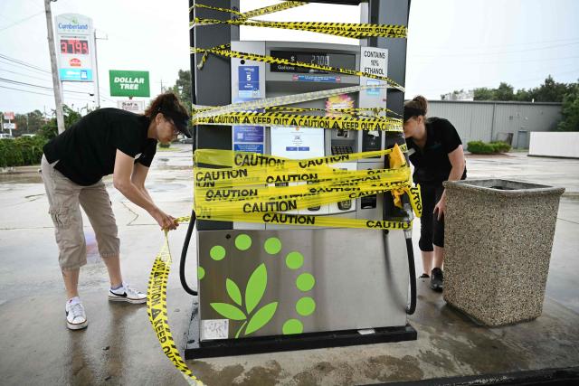 Workers cordon off a gas pump with yellow tape at a gas station in Navarre, Florida, on October 9, 2026, as Hurricane Isaias moves north toward the Florida Panhandle. Hurricane Isaias intensified to Category 2 in the Gulf of Mexico's warm waters on Thursday as it churned toward the southern United States, the National Hurricane Center (NHC) said.
The first hurricane of the Atlantic season, Isaias is forecast to make landfall in Florida, Alabama or Mississippi overnight Friday to Saturday, according to the NHC. (Photo by RONALDO SCHEMIDT / AFP)