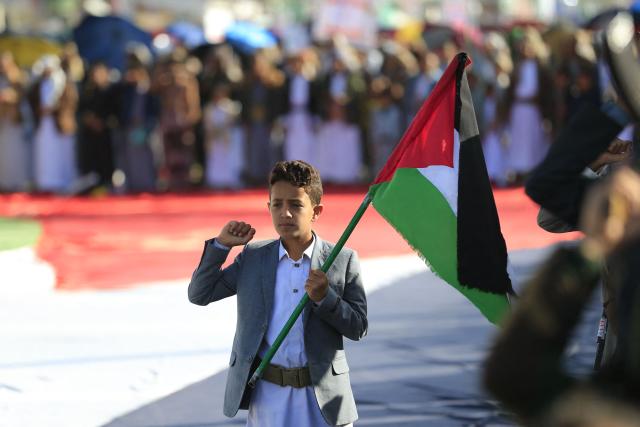 Supporters of the Houthi authorities gather during a protest against the Saudi intervention in Yemen, in Sanaa, on October 9, 2026. The Houthis, who are fighting the Saudi-backed, internationally recognised government, seized the coastline alongside crucial trade route during a lightning offensive last month, extending their control over all of Yemen's Red Sea coast. Yemeni government forces have been attempting for several days to retake coastal territory captured by the pro-Iranian fighters. (Photo by Mohammed HUWAIS / AFP)