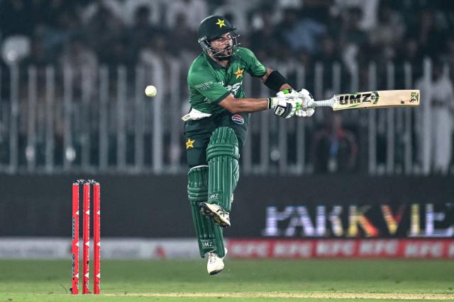 Pakistan's captain Sahibzada Farhan reacts after being hit by the ball during the first T20 international cricket match between Pakistan and Sri Lanka at the Rawalpindi Cricket Stadium in Rawalpindi on October 9, 2026. (Photo by FAROOQ NAEEM / AFP)