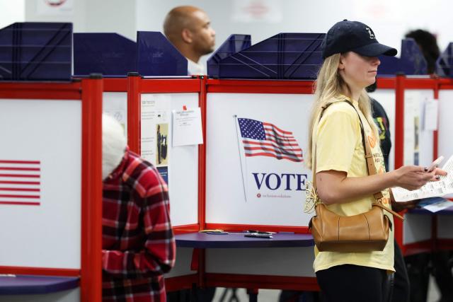 People cast their ballots during early voting at the Hamilton County Board of Elections on October 09, 2026 in Norwood, Ohio. (Photo by Samuel Corum / POOL / AFP)