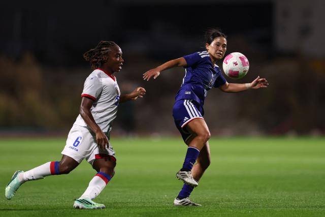 Japan's midfielder #10 Fuka Nagano (R) fights for the ball with Haiti's midfielder #06 Melchie Dumornay  during the women's international friendly football match between Haiti and Japan at the Bauer Stadium in Saint-Ouen, north of Paris, on October 9, 2026. (Photo by FRANCK FIFE / AFP)