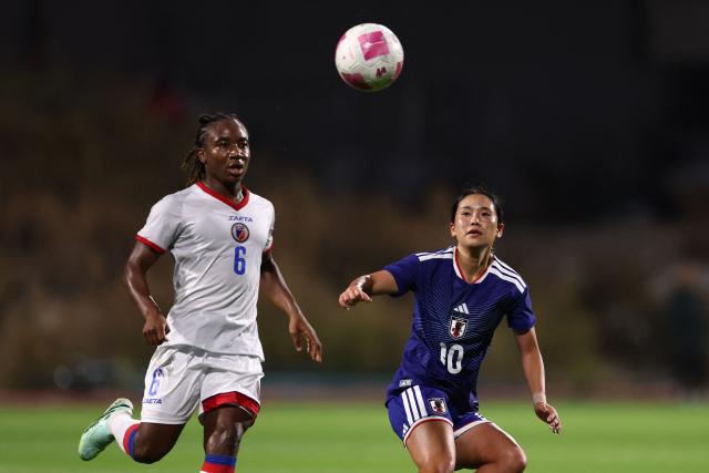 Japan's midfielder #10 Fuka Nagano (R) fights for the ball with Haiti's midfielder #06 Melchie Dumornay  during the women's international friendly football match between Haiti and Japan at the Bauer Stadium in Saint-Ouen, north of Paris, on October 9, 2026. (Photo by FRANCK FIFE / AFP)