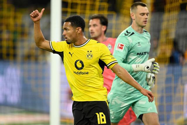 Dortmund's English forward #18 Ethan Nwaneri reacts during the German first division Bundesliga football match between BVB Borussia Dortmund and Werder Bremen in Dortmund, western Germany on October 9, 2026. (Photo by INA FASSBENDER / AFP) / DFL REGULATIONS PROHIBIT ANY USE OF PHOTOGRAPHS AS IMAGE SEQUENCES AND/OR QUASI-VIDEO