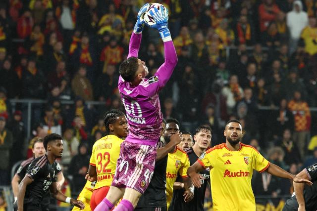 Lens' French goalkeeper #40 Robin Risser catches the ball during the French L1 football match between RC Lens and Olympique Lyonnais (OL) at the Stade Bollaert-Delelis in Lens, northern France, on October 9, 2026. (Photo by Sameer AL-DOUMY / AFP)