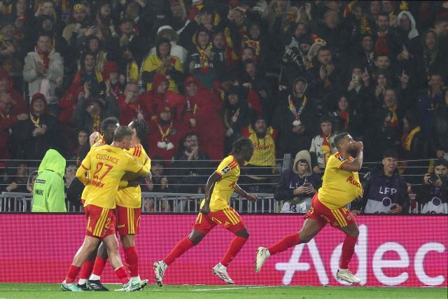 Lens' French defender #14 Matthieu Udol celebrates scoring his team's second goal during the French L1 football match between RC Lens and Olympique Lyonnais (OL) at the Stade Bollaert-Delelis in Lens, northern France, on October 9, 2026. (Photo by Sameer AL-DOUMY / AFP)