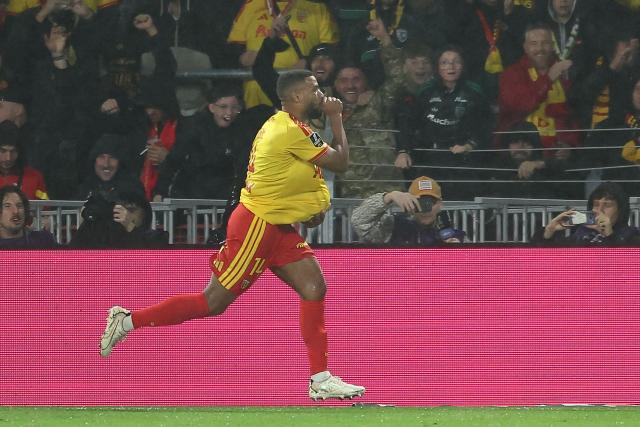 Lens' French defender #14 Matthieu Udol celebrates scoring his team's second goal during the French L1 football match between RC Lens and Olympique Lyonnais (OL) at the Stade Bollaert-Delelis in Lens, northern France, on October 9, 2026. (Photo by Sameer AL-DOUMY / AFP)