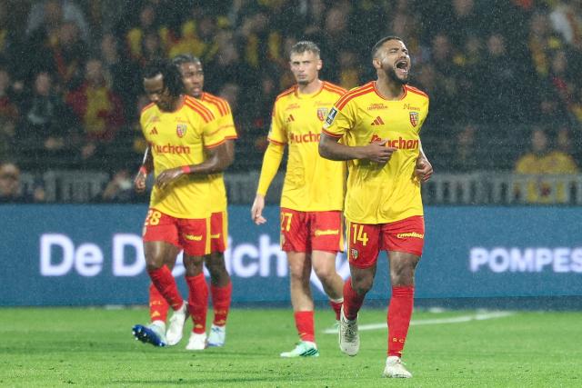 Lens' French defender #14 Matthieu Udol celebrates scoring his team's second goal during the French L1 football match between RC Lens and Olympique Lyonnais (OL) at the Stade Bollaert-Delelis in Lens, northern France, on October 9, 2026. (Photo by Sameer AL-DOUMY / AFP)