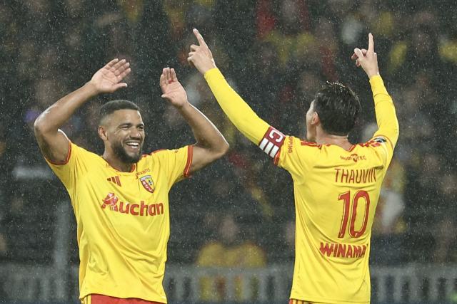 Lens' French defender #14 Matthieu Udol celebrates scoring his team's second goal during the French L1 football match between RC Lens and Olympique Lyonnais (OL) at the Stade Bollaert-Delelis in Lens, northern France, on October 9, 2026. (Photo by Sameer AL-DOUMY / AFP)