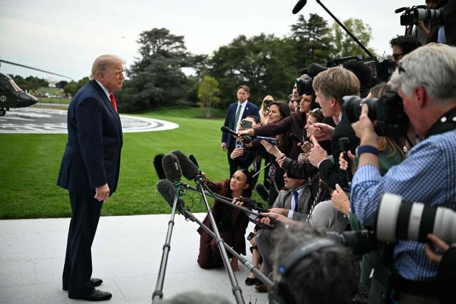 US President Donald Trump speaks to the press before boarding Marine One as he departs from the South Lawn of the White House in Washington, DC, on October 9, 2026. Trump is traveling to Syracuse, New York, to speak at a campaign rally. (Photo by Alex WROBLEWSKI / AFP)