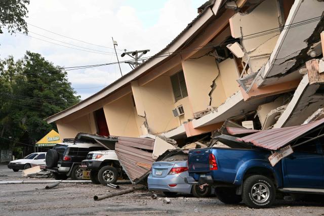 This view shows a collapsed building and damaged cars after a 7.6-magnitude earthquake struck the country, in Penonome, Panama, on October 9, 2026. According to the US Geological Survey (USGS), a magnitude 7.6 earthquake shook Panama sparking panic in the capital, though no casualties or damage have been reported so far. (Photo by MARTIN BERNETTI / AFP)