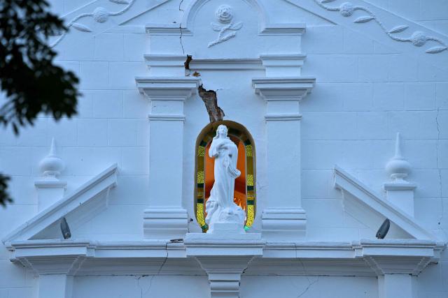 This view shows damage to part of the Cathedral of Penonome after a 7.6-magnitude earthquake struck the country, in Penonome, Panama, on October 9, 2026. According to the US Geological Survey (USGS), a magnitude 7.6 earthquake shook Panama sparking panic in the capital, though no casualties or damage have been reported so far. (Photo by MARTIN BERNETTI / AFP)