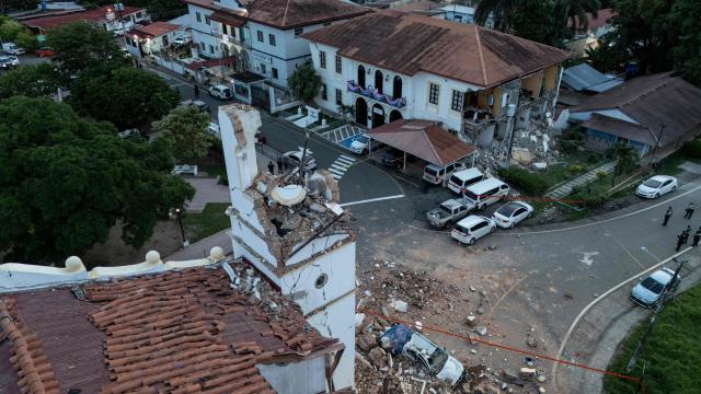 This aerial view shows the collapsed Cathedral (L) and the collapsed Penonome Governor's Office building after a 7.6-magnitude earthquake struck the country, in Penonome, Panama, on October 9, 2026. According to the US Geological Survey (USGS), a magnitude 7.6 earthquake shook Panama sparking panic in the capital, though no casualties or damage have been reported so far. (Photo by Martin BERNETTI / AFP)