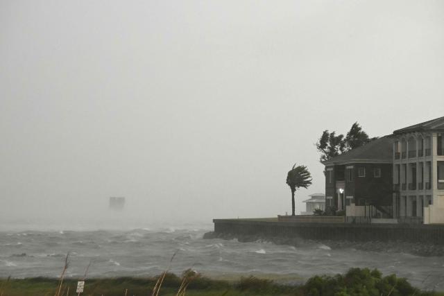 A house is battered by the strong winds and storm surge of Hurricane Isaias in Pensacola, Florida, on October 9, 2026. Hurricane Isaias's outer bands were lashing the US Gulf Coast with heavy rain and strong winds Friday, with the category 3 storm triggering mandatory evacuations and poised to bring life-threatening storm surge when it makes landfall. (Photo by RONALDO SCHEMIDT / AFP)