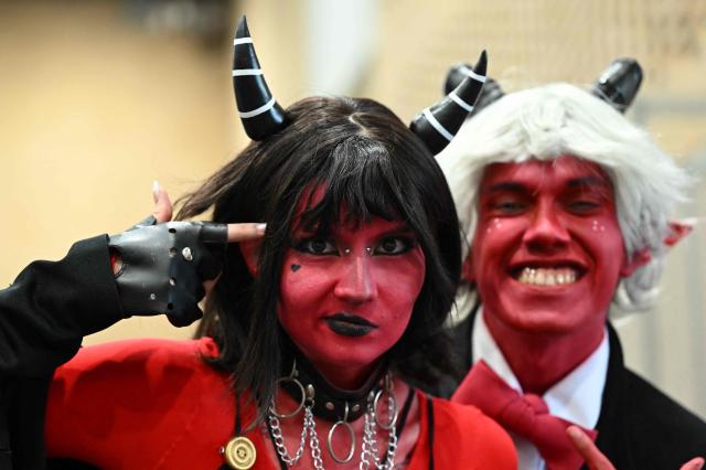 A couple wearing cosplay outfits takes part in the SOFA Leisure and Fantasy Fair in Bogota on October 9, 2026. (Photo by Raul ARBOLEDA / AFP)