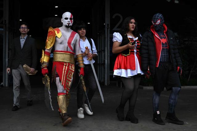 People wearing cosplay costumes take part in the SOFA Leisure and Fantasy Fair in Bogota on October 9, 2026. (Photo by Raul ARBOLEDA / AFP)