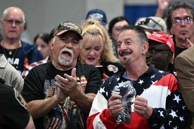 Supporters react as US President Donald Trump speaks at a campaign rally at the Oncenter Convention Center in Syracuse, New York, on October 9, 2026. President Trump is campaigning for Republican nominee for New York governor, Bruce Blakeman, as well as other Republican candidates in November's general election. (Photo by Mandel NGAN / AFP)