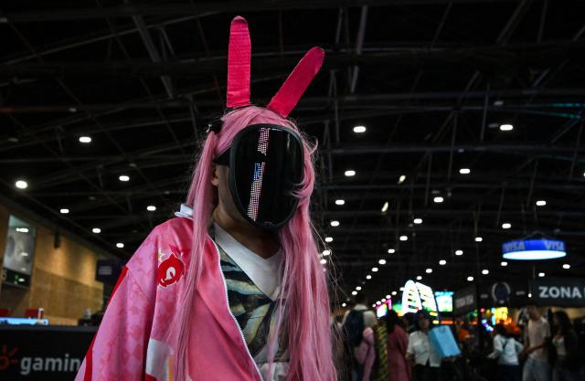 A person wearing a costume performs at the SOFA Leisure and Fantasy Fair in Bogota on October 9, 2026. (Photo by Raul ARBOLEDA / AFP)