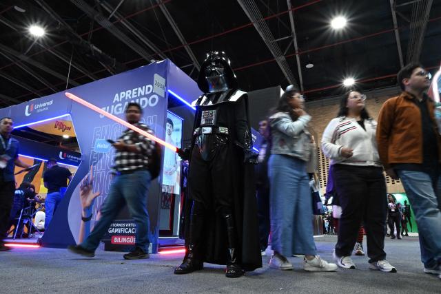 A man wearing a Darth Vader costume from Star Wars takes part in the SOFA Leisure and Fantasy Fair in Bogota on October 9, 2026. (Photo by Raul ARBOLEDA / AFP)