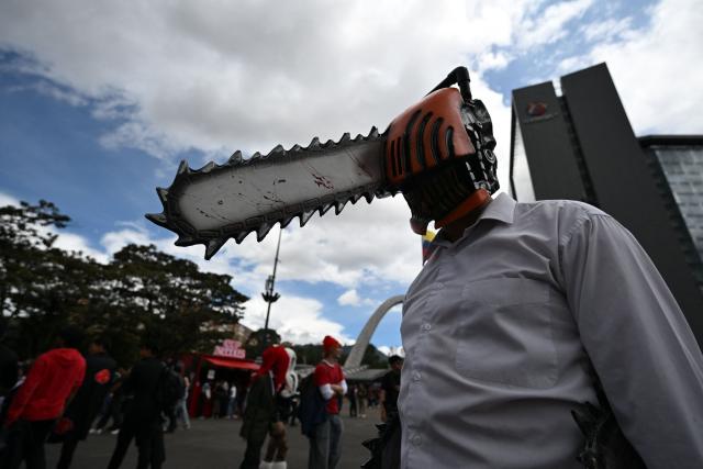 A man wearing a Chainsaw Man anime cosplay costume takes part in the SOFA Leisure and Fantasy Fair in Bogota on October 9, 2026. (Photo by Raul ARBOLEDA / AFP)