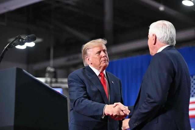 US President Donald Trump shakes hands with Republican candidate for New York governor Bruce Blakeman at a campaign rally at the Oncenter Convention Center in Syracuse, New York, on October 9, 2026. President Trump is campaigning for Blakeman, as well as other Republican candidates in November's general election. (Photo by Mandel NGAN / AFP)
