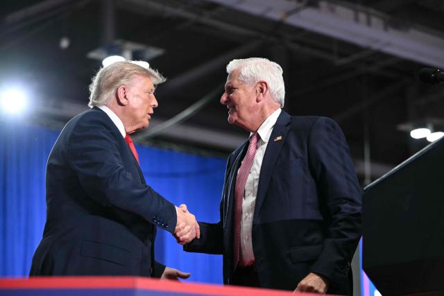 US President Donald Trump shakes hands with Republican candidate for New York governor Bruce Blakeman at a campaign rally at the Oncenter Convention Center in Syracuse, New York, on October 9, 2026. President Trump is campaigning for Blakeman, as well as other Republican candidates in November's general election. (Photo by Mandel NGAN / AFP)