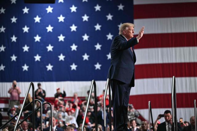US President Donald Trump waves as he walks off stage after speaking at a campaign rally at the Oncenter Convention Center in Syracuse, New York, on October 9, 2026. President Trump is campaigning for Republican nominee for New York governor, Bruce Blakeman, as well as other Republican candidates in November's general election. (Photo by Mandel NGAN / AFP)