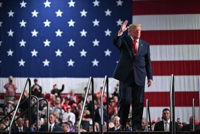 US President Donald Trump waves as he walks off stage after speaking at a campaign rally at the Oncenter Convention Center in Syracuse, New York, on October 9, 2026. President Trump is campaigning for Republican nominee for New York governor, Bruce Blakeman, as well as other Republican candidates in November's general election. (Photo by Mandel NGAN / AFP)