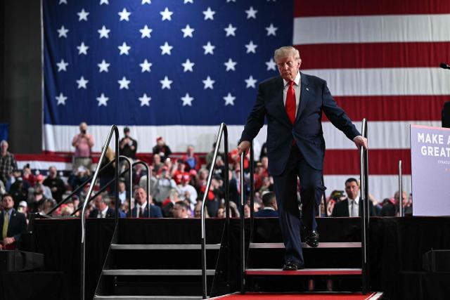 US President Donald Trump walks off stage after speaking at a campaign rally at the Oncenter Convention Center in Syracuse, New York, on October 9, 2026. President Trump is campaigning for Republican nominee for New York governor, Bruce Blakeman, as well as other Republican candidates in November's general election. (Photo by Mandel NGAN / AFP)