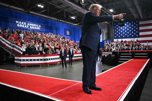 US President Donald Trump points to the crowd as he walks off stage after speaking at a campaign rally at the Oncenter Convention Center in Syracuse, New York, on October 9, 2026. President Trump is campaigning for Republican nominee for New York governor, Bruce Blakeman, as well as other Republican candidates in November's general election. (Photo by Mandel NGAN / AFP)
