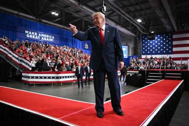 US President Donald Trump points to the crowd as he walks off stage after speaking at a campaign rally at the Oncenter Convention Center in Syracuse, New York, on October 9, 2026. President Trump is campaigning for Republican nominee for New York governor, Bruce Blakeman, as well as other Republican candidates in November's general election. (Photo by Mandel NGAN / AFP)