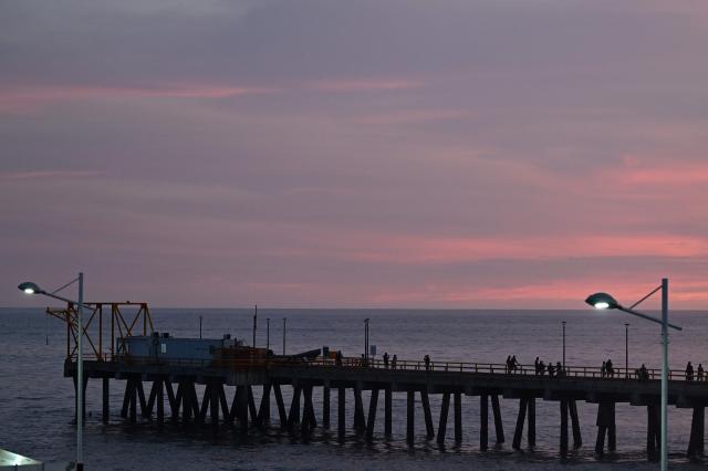This view shows the sunset from the pier at the port of La Libertad, El Salvador, on October 9, 2026. (Photo by Marvin RECINOS / AFP)