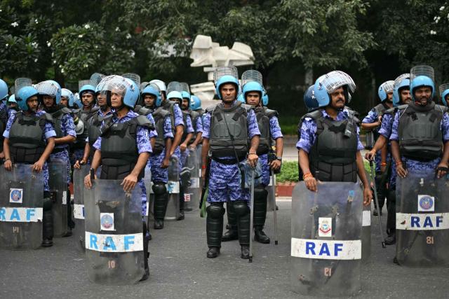 Rapid Action Force (RAF) personnel stand guard ahead of a protest by the youth-led Cockroach Janata Party (CJP) demanding the resignation of India’s Chief Election Commissioner over alleged "special intensive revision” (SIR) voter-roll irregularities, in New Delhi on October 10, 2026. India deployed thousands of police in its capital and restricted transportation in and around Delhi ahead of mass demonstrations on October 10 demanding the resignation of the country's election chief over alleged voter-roll irregularities. (Photo by Manan VATSYAYANA / AFP)