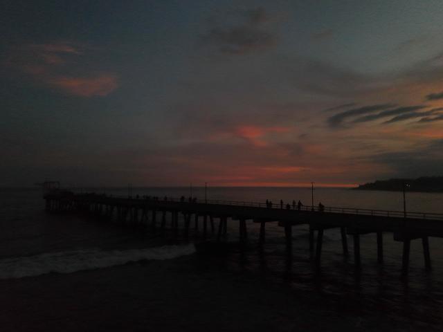 This view shows the sunset from the pier at the port of La Libertad, El Salvador, on October 9, 2026. (Photo by Marvin RECINOS / AFP)