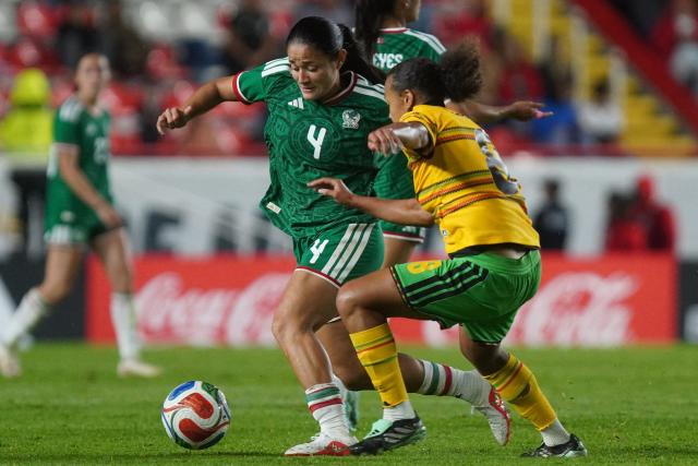 Rebeca Mexico's defender #4 Rebeca Bernal and Jamaica’s midfielder #8 Drew Spence fight for the ball during the women's international friendly football match between Mexico and Jamaica at Victoria stadium in Aguascalientes, Mexico, on October 9, 2026. (Photo by Mario ARMAS / AFP)