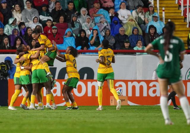 Jamaica’s players celebrate a goal during the women's international friendly football match between Mexico and Jamaica at Victoria stadium in Aguascalientes, Mexico, on October 9, 2026. (Photo by Mario ARMAS / AFP)